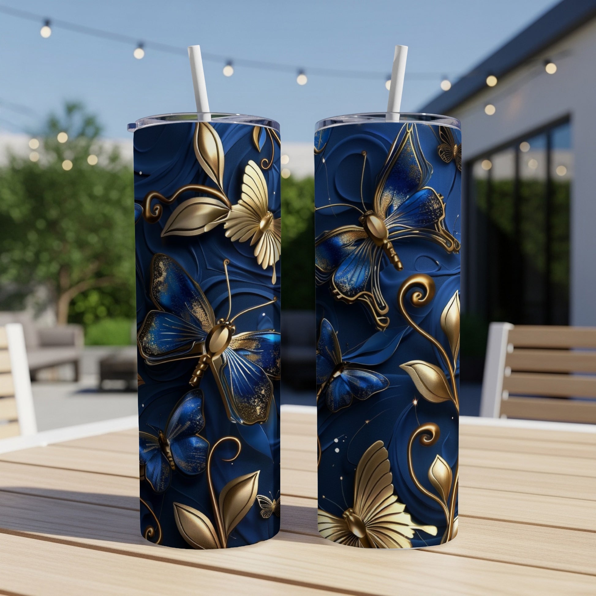 Two tall tumblers with a blue and gold butterfly design.