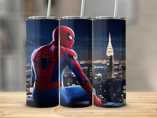 Spiderman looking over a city skyline at night.