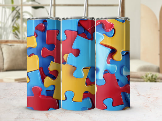 Three tumblers featuring colorful puzzle pieces in red, blue, and yellow.