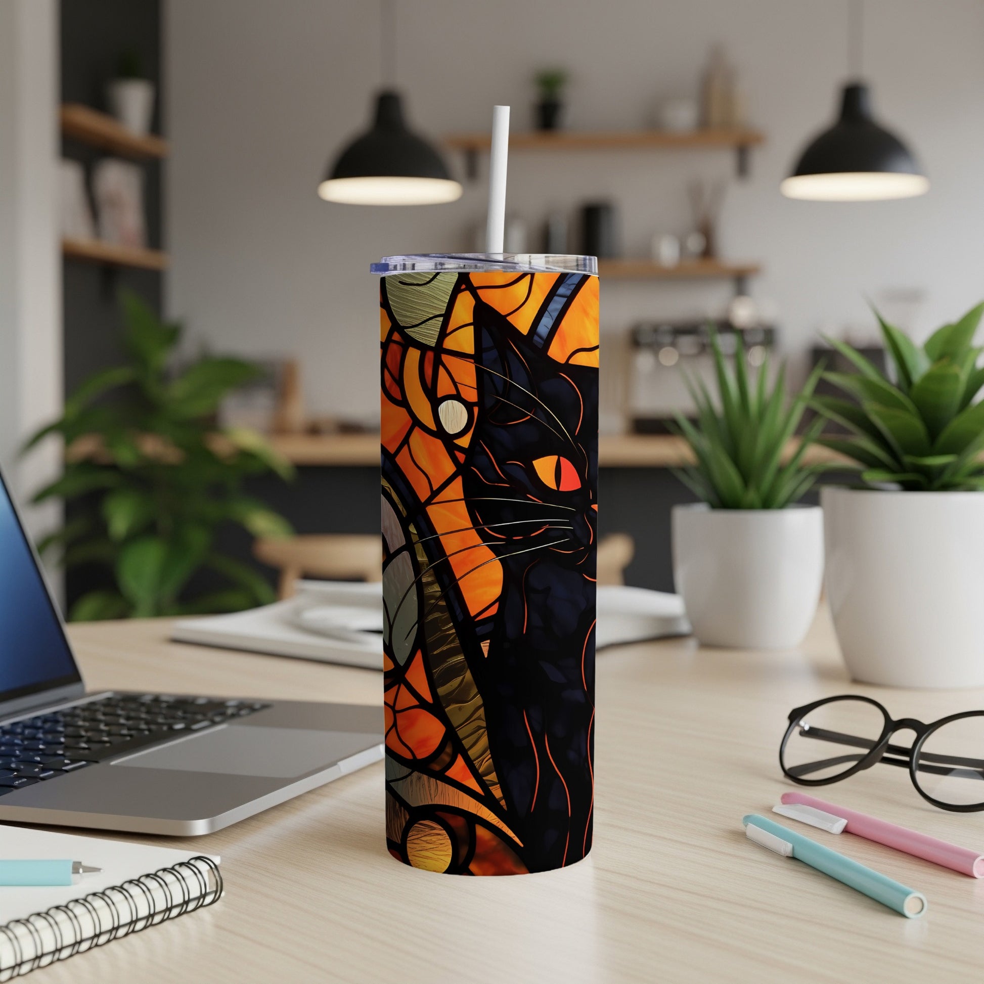 Black cat with stained glass pattern on a skinny tumbler with straw.