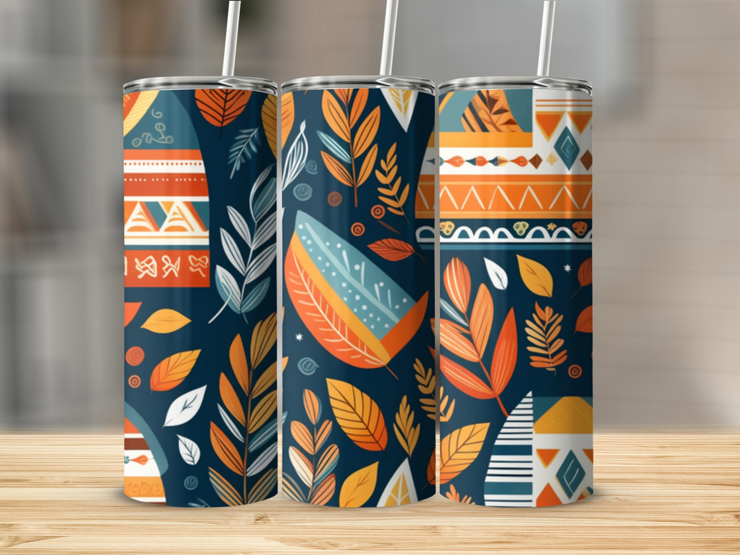 Three tumblers with colorful geometric and leaf patterns.