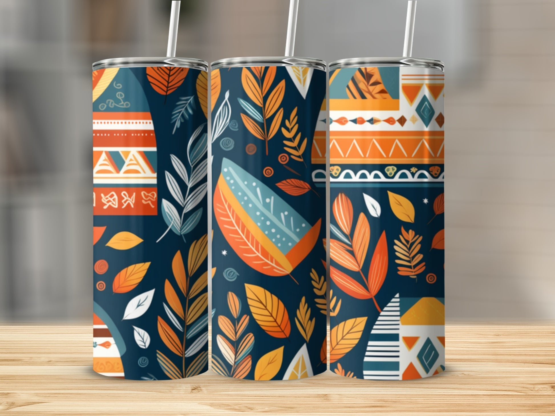 Three tumblers with colorful geometric and leaf patterns.