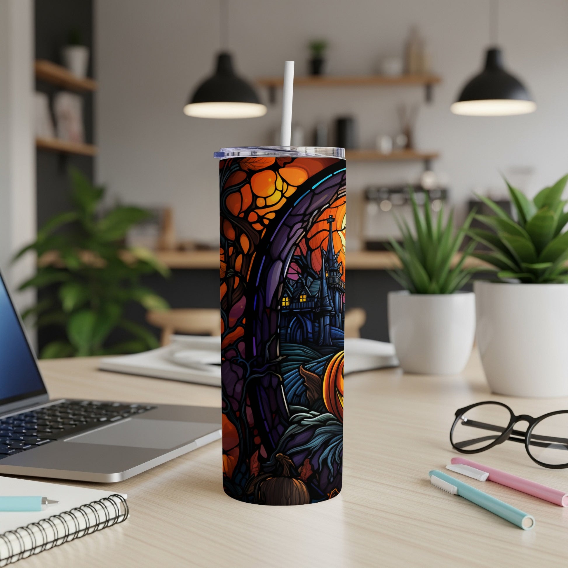 Halloween tumbler with haunted castle and pumpkin design.