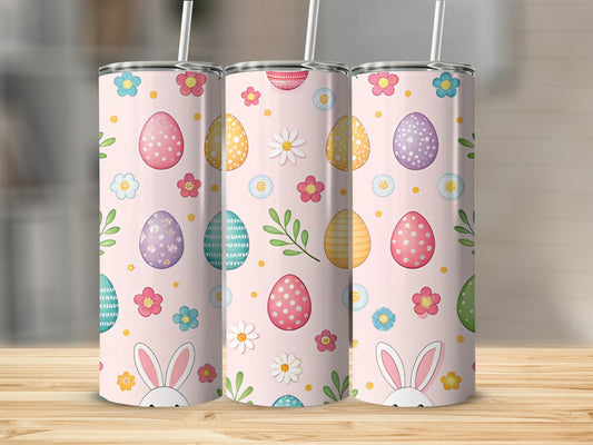 Three pink tumblers with Easter eggs, flowers, and bunny ears pattern.