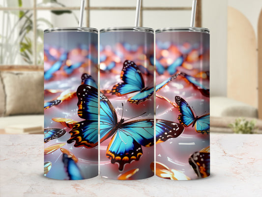Three tumblers with blue butterflies and gold accents.