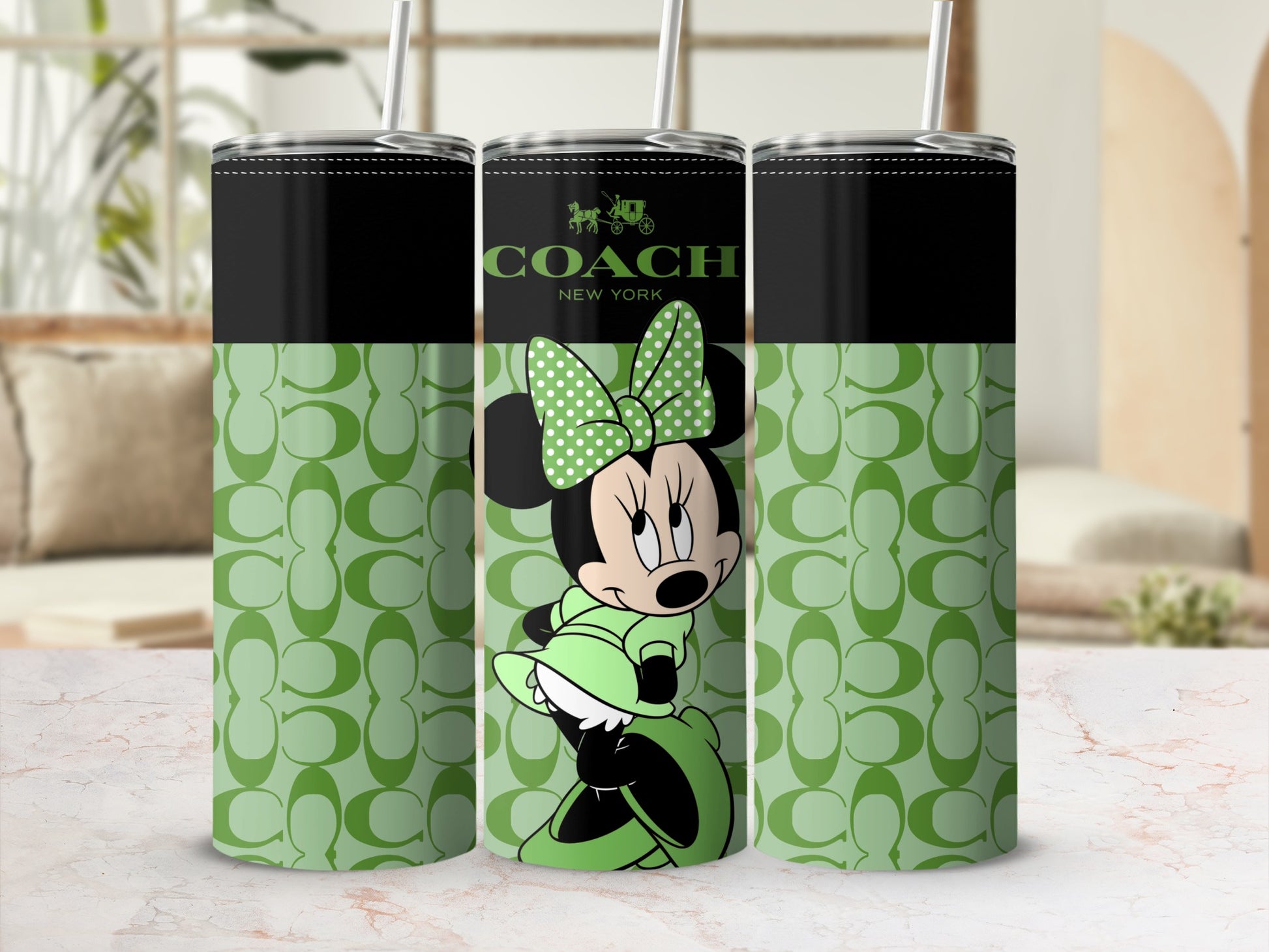 Coach New York Minnie Mouse green tumbler with all-over C logo pattern.