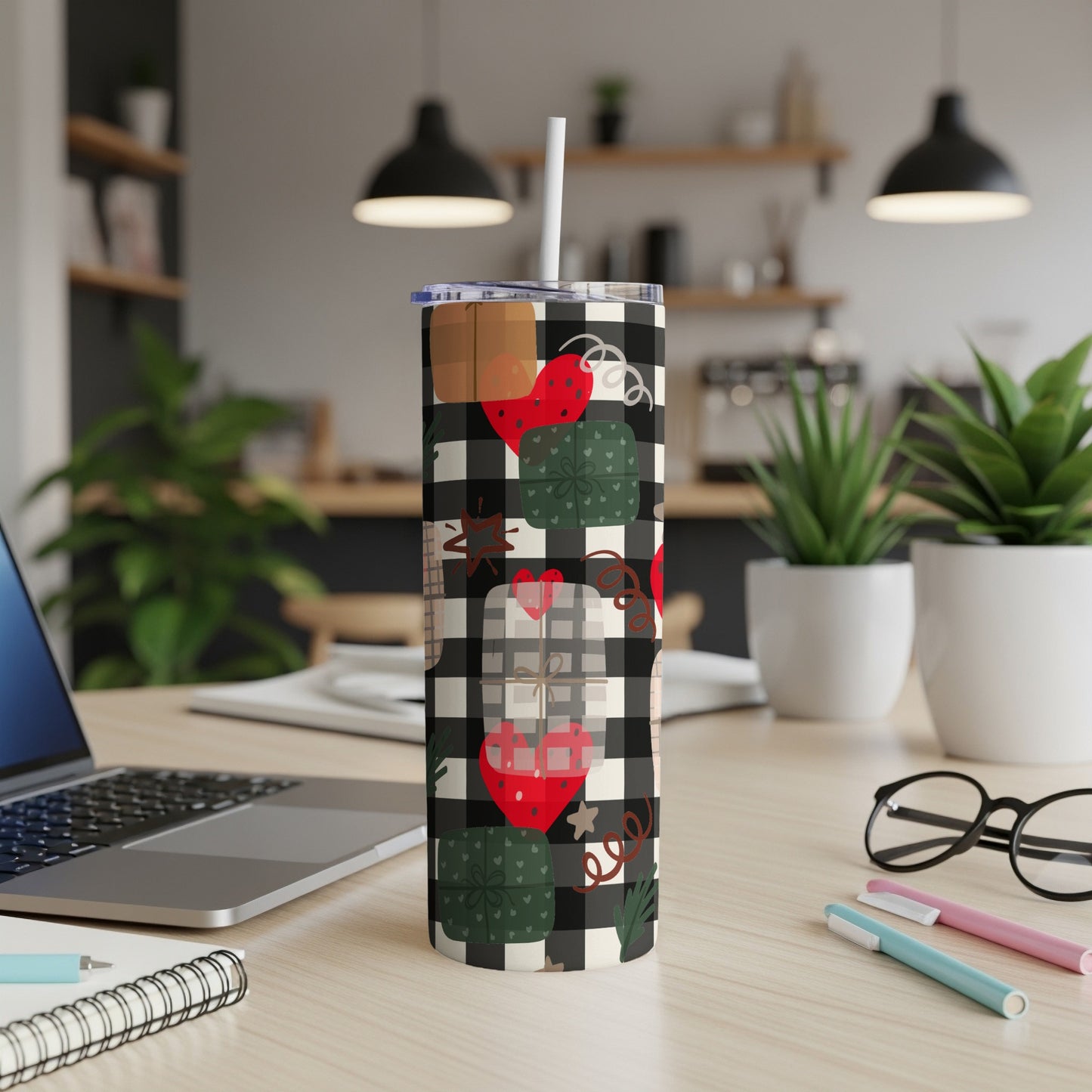 Black and white checkered tumbler with hearts and gifts.
