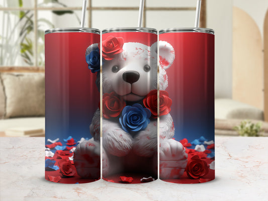 White teddy bear with red and blue roses, on a spilled rose petal background.
