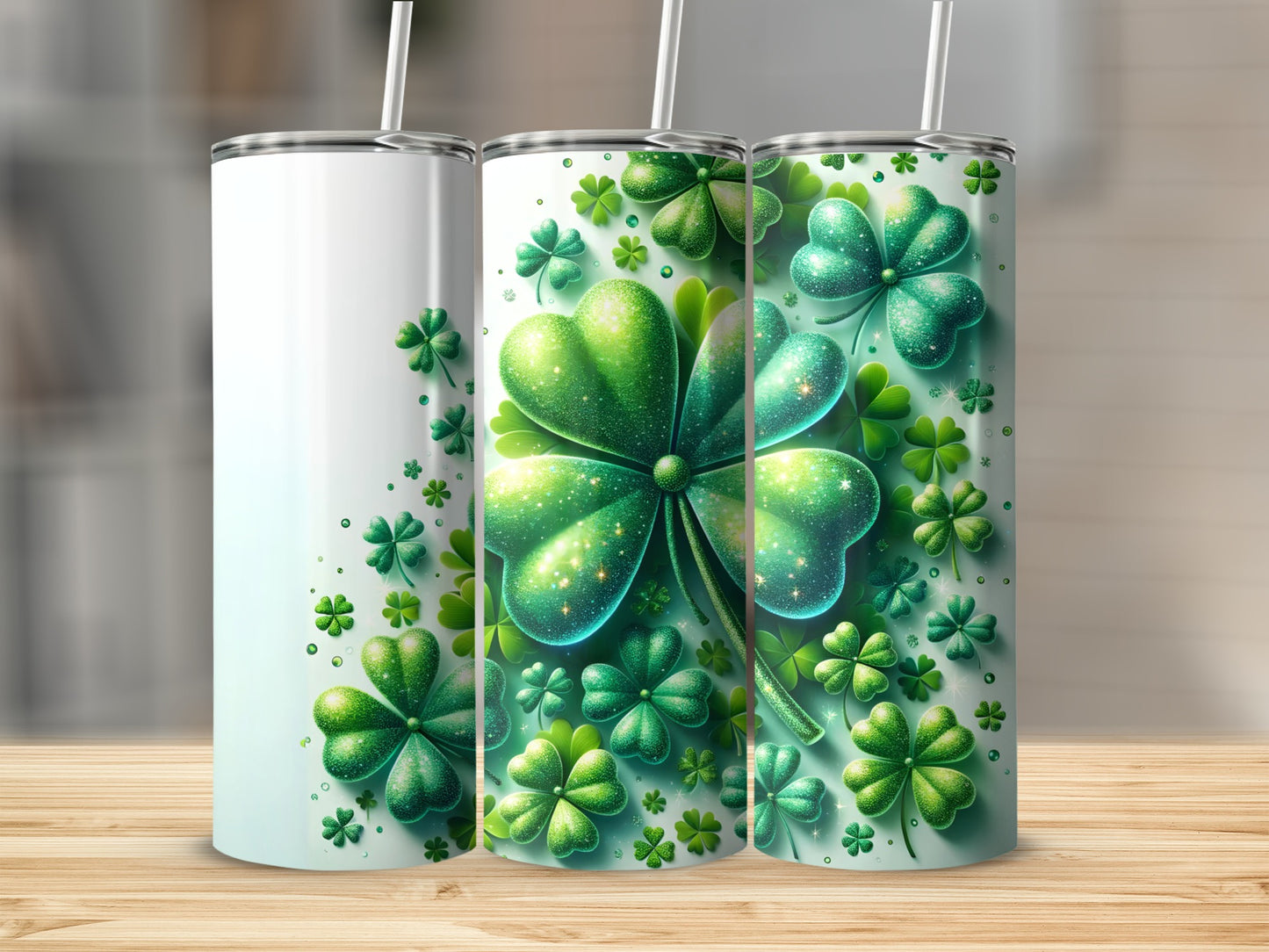 Three tumblers with green shamrocks and glitter.