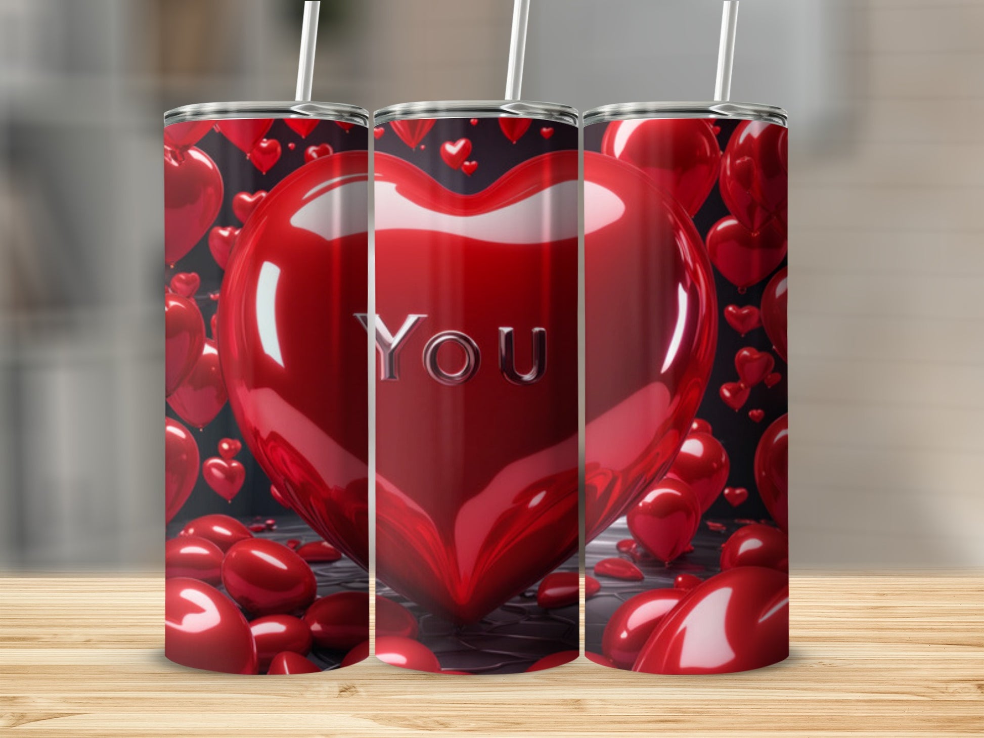 Three tumblers with red heart designs, one featuring the word "YOU".