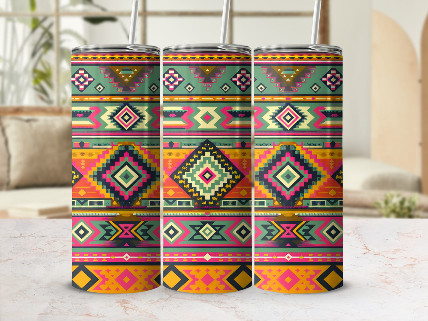 Three tumblers with colorful geometric Southwestern patterns on a marble surface.