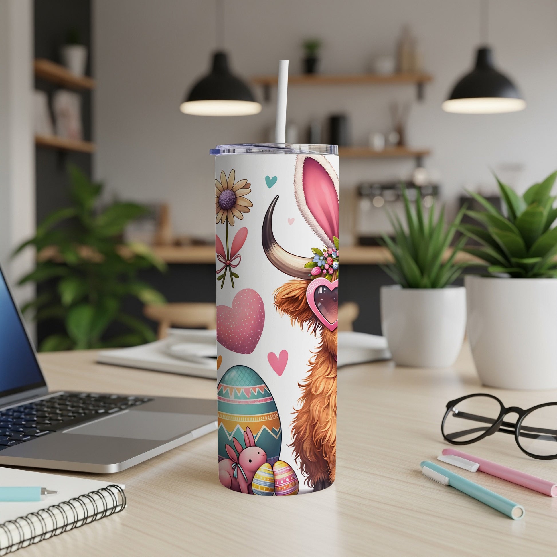Easter Highland cow tumbler with hearts, eggs, and bunny graphic.