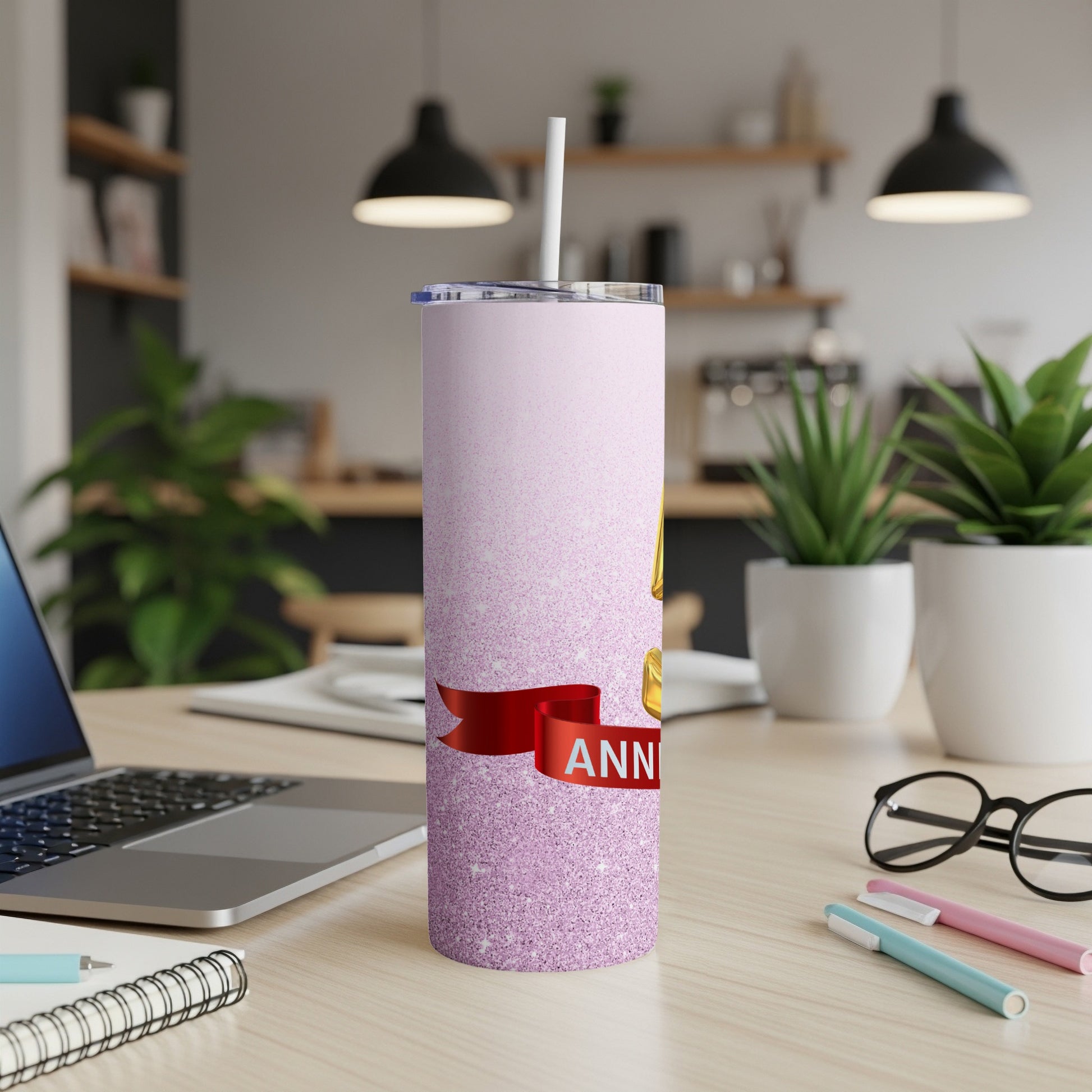 Pink glitter tumbler with red ribbon and "ANNIVERSARY" text.