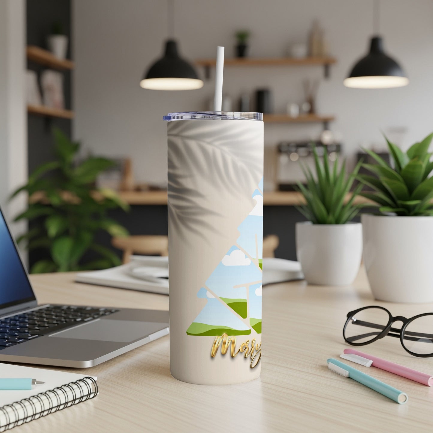 Cream tumbler with palm leaf shadow and tree scene, reads "Merry"