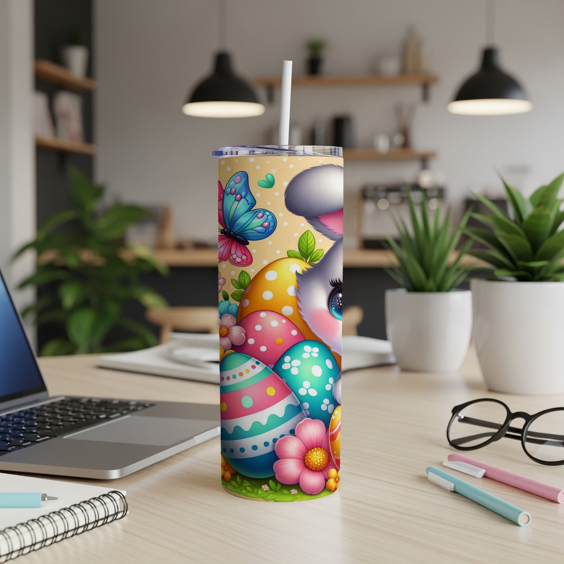 Easter bunny with colorful eggs and butterflies on a tumbler.