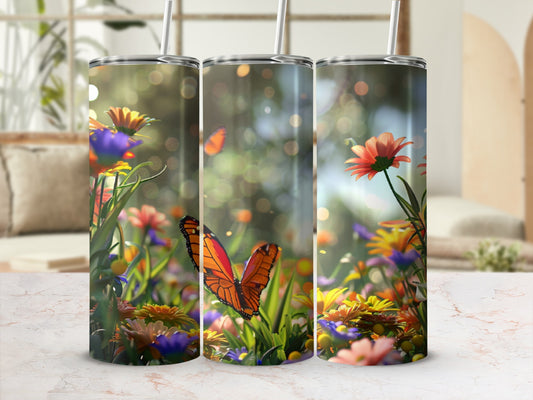 Three tumblers featuring orange butterflies and colorful flowers in a garden.