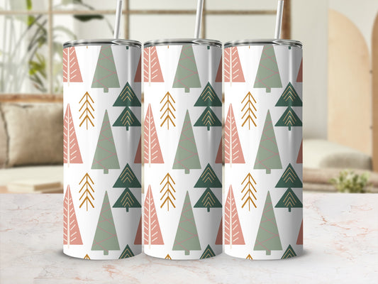 Three tumblers with a repeating pattern of pine trees in green, pink, and gold.