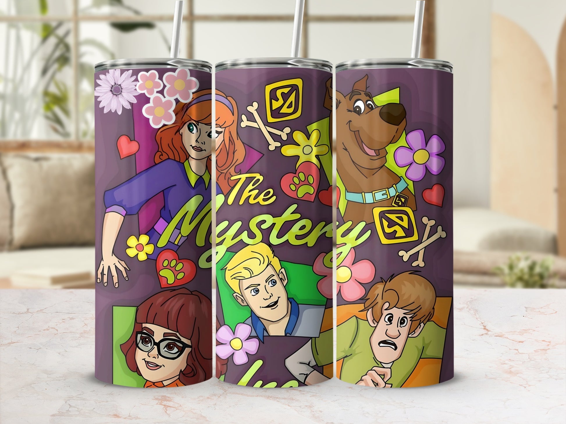 Scooby-Doo characters and logo on purple patterned tumbler with flowers.