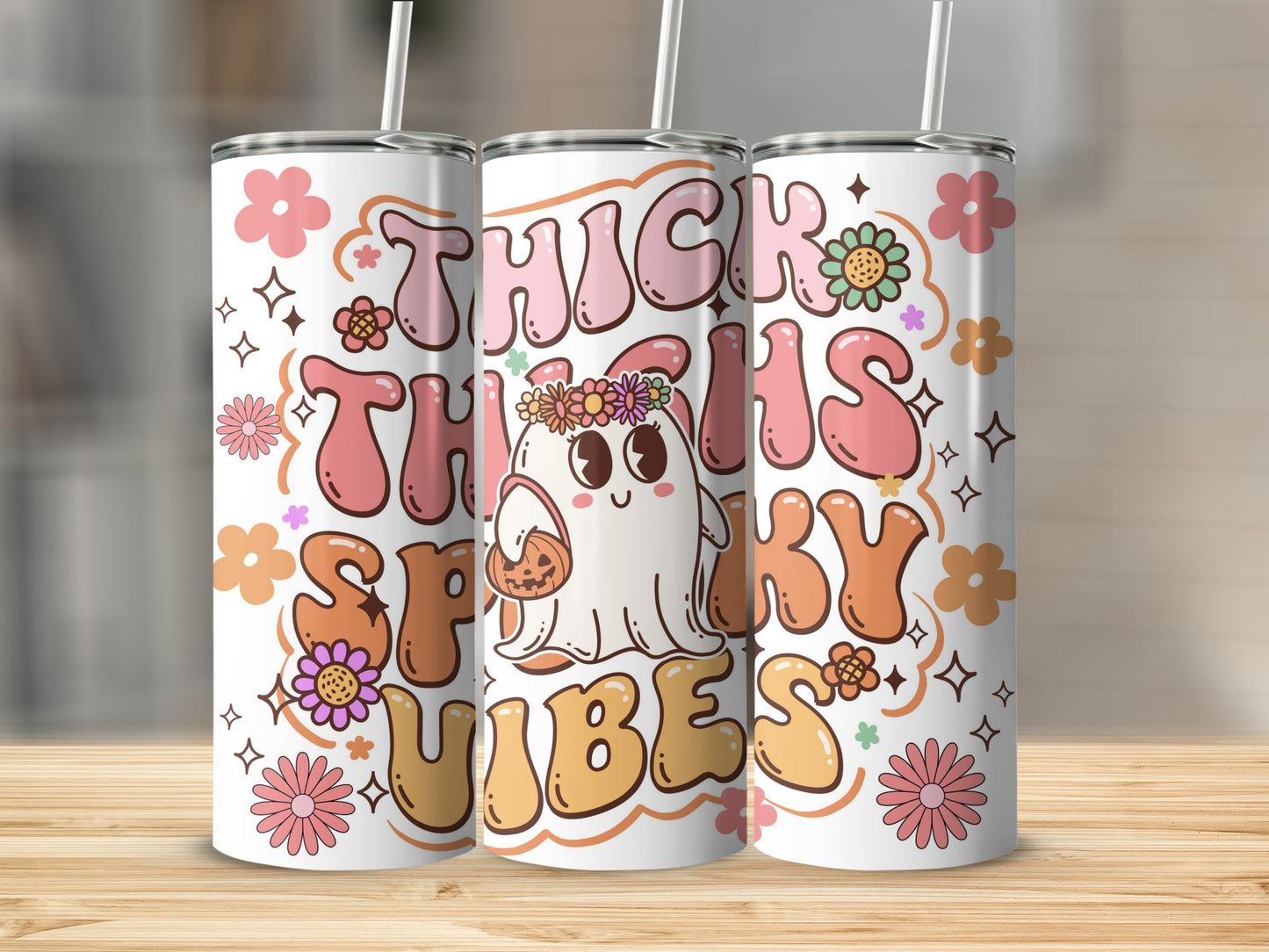 Tumbler with "Thick Thighs Spooky Vibes" text, ghost holding pumpkin, and floral graphics.