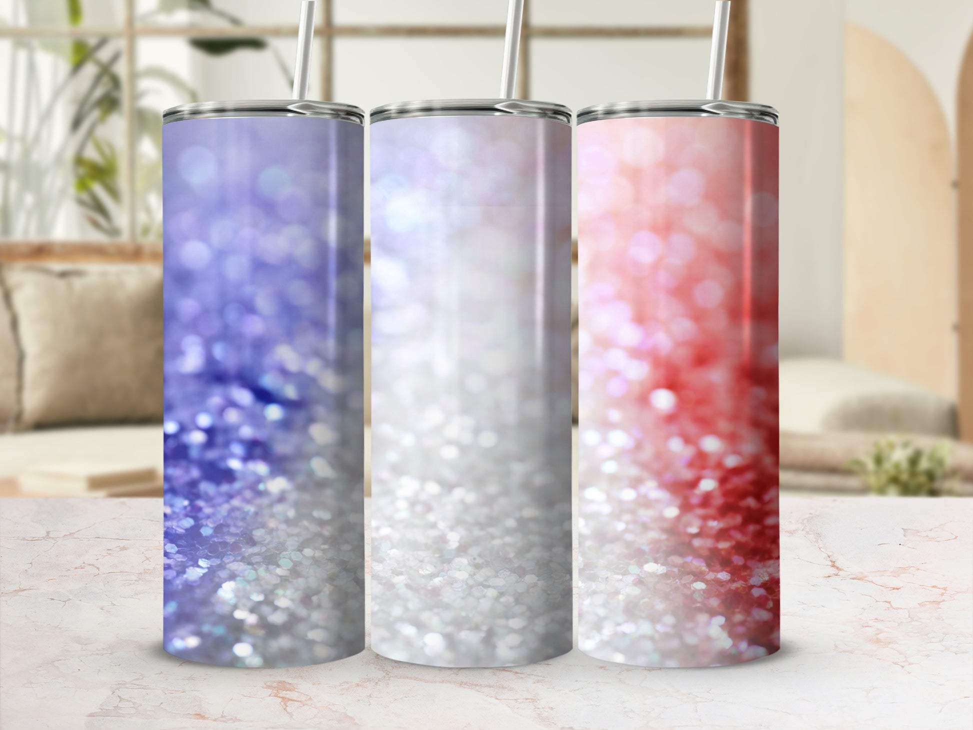 Three glitter tumblers with purple, white, and red ombre patterns.