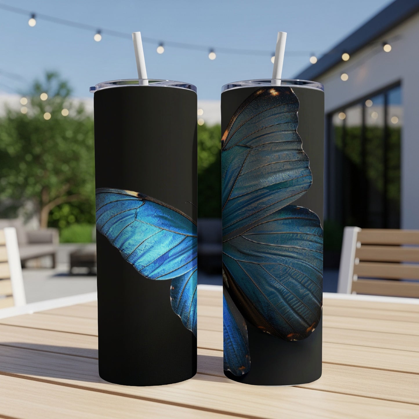 Two tall tumblers with a close-up blue butterfly wing design.