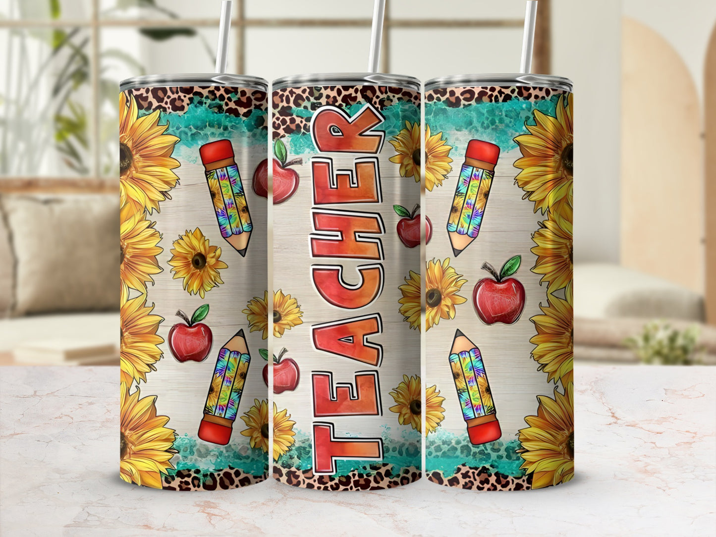 Three tumblers with sunflowers, apples, pencils, and the word "TEACHER".