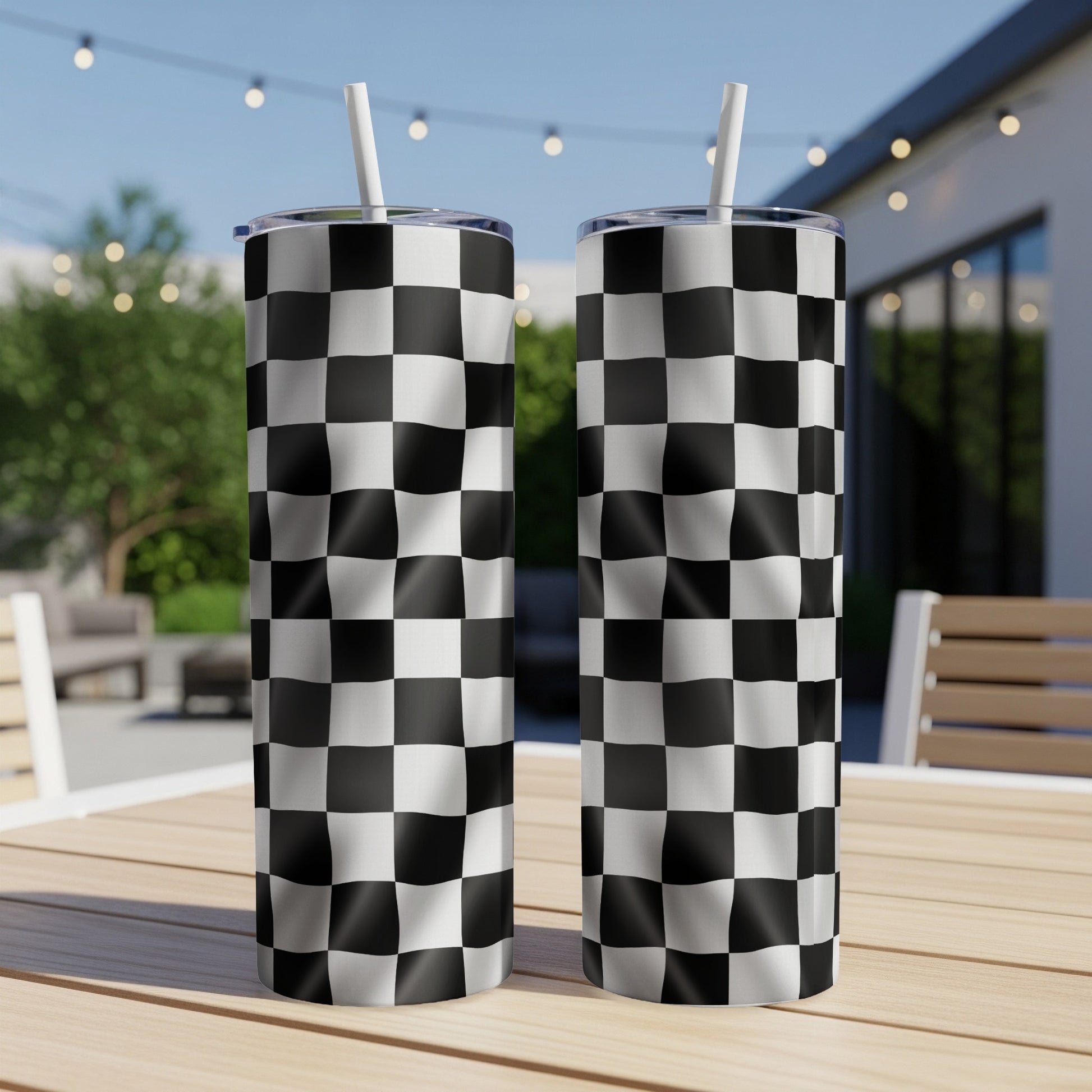 Two tumblers with black and white checkered racing flag pattern.