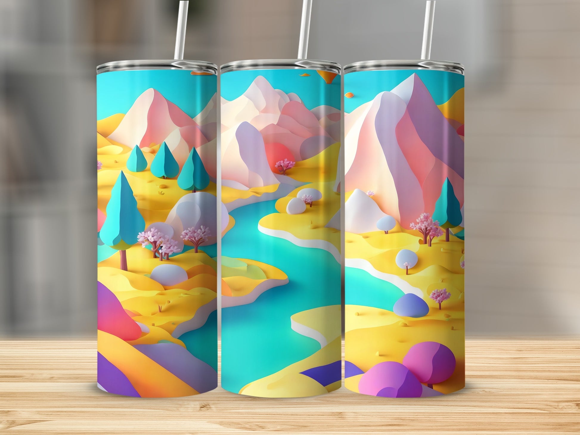Three tall tumblers with a colorful, abstract landscape design of mountains, trees, and a river.
