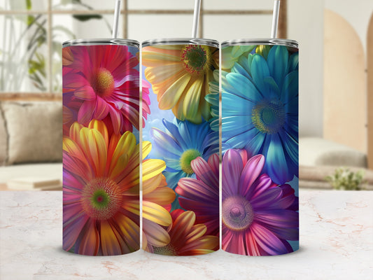 Three tumblers with vibrant floral designs of red, yellow, and blue flowers.