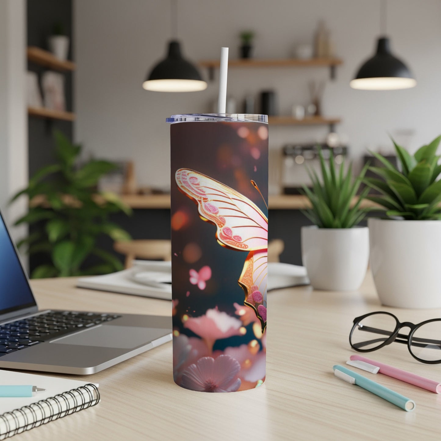 Tumbler with a pink butterfly and floral pattern.