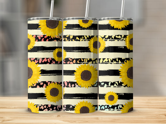 Three tumblers with black and yellow stripes and sunflower designs.