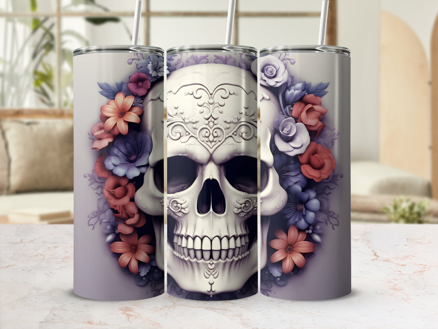 Floral skull tumbler with straws on a marble countertop.