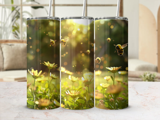 Three tumblers with bees and daisies in sunlight.