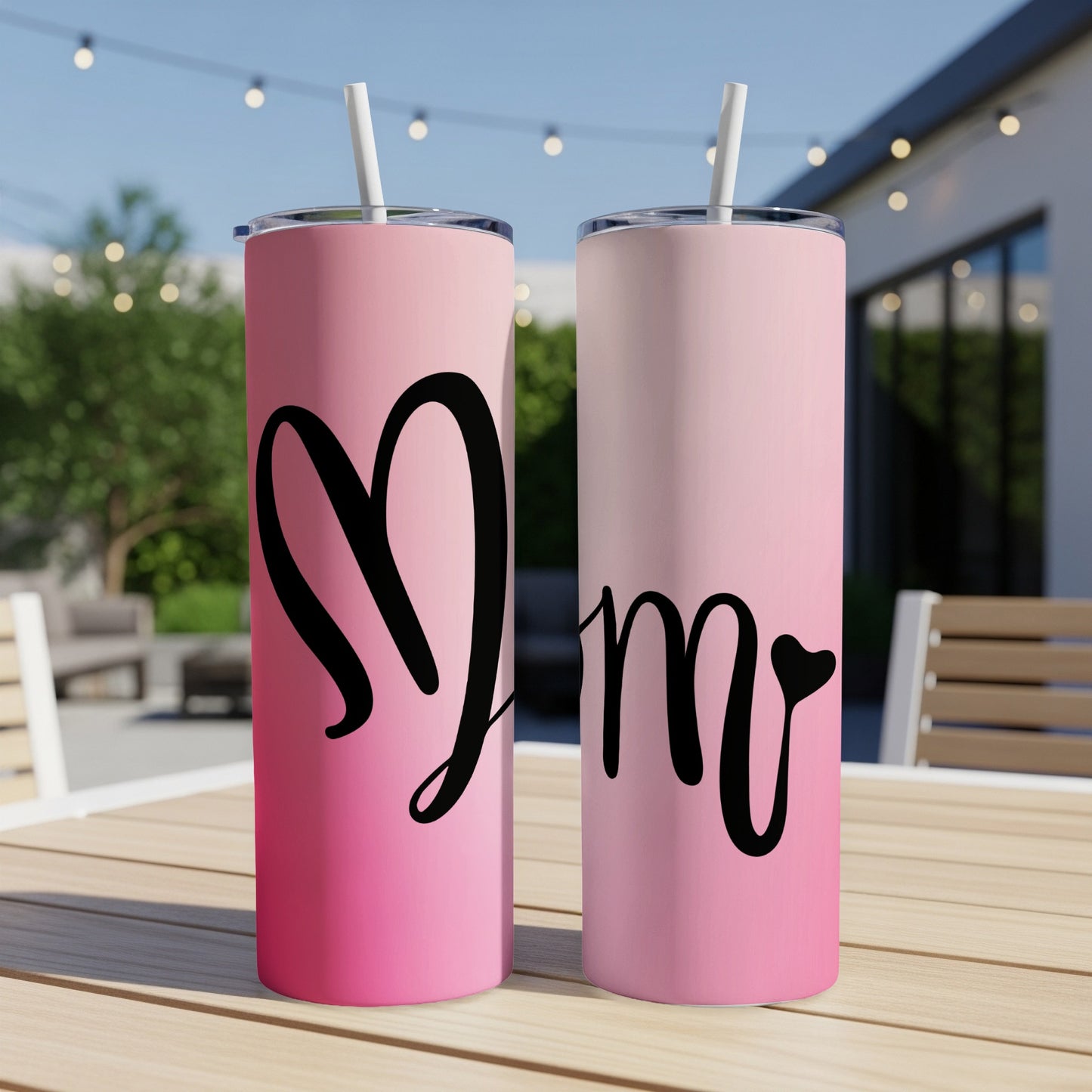 Two pink gradient tumblers with straw, one with a heart and one with "mom".
