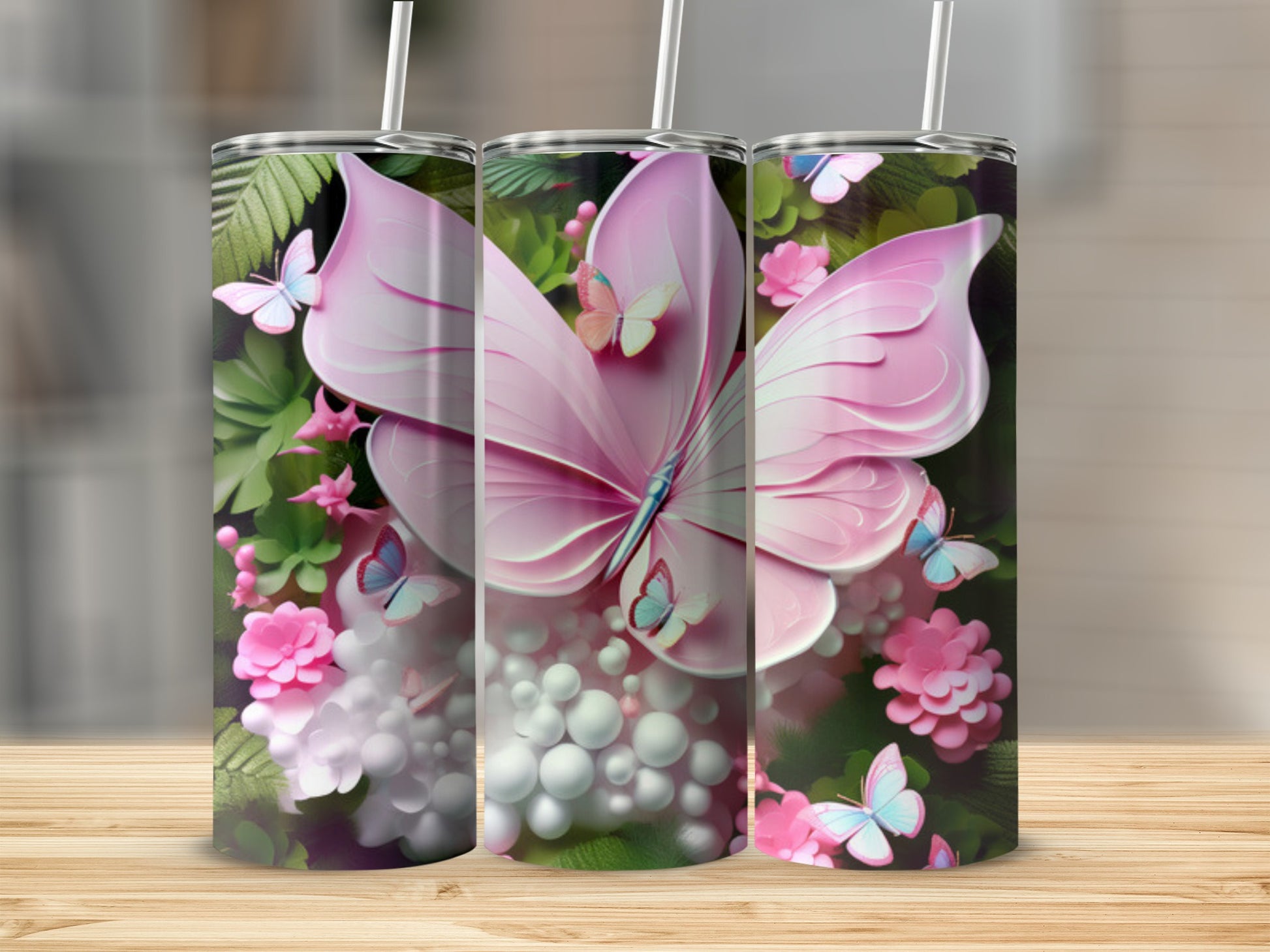 Pink butterfly and floral design on a stainless steel tumbler.