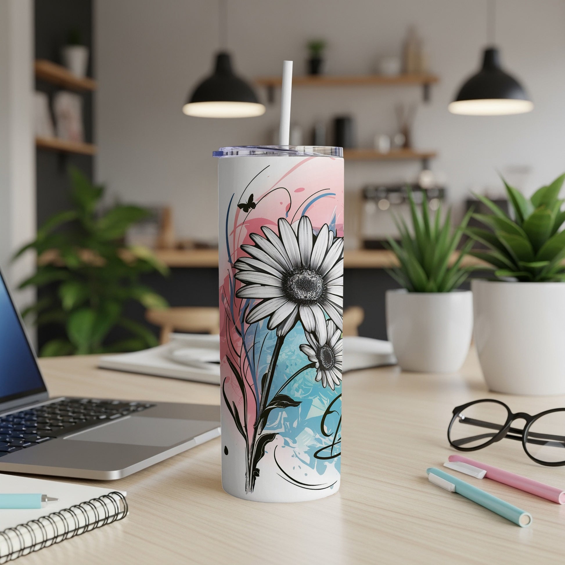 White tumbler with abstract floral design, butterfly, and lid.