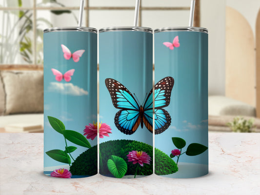 Tumbler with blue butterflies, pink flowers, and green leaves.