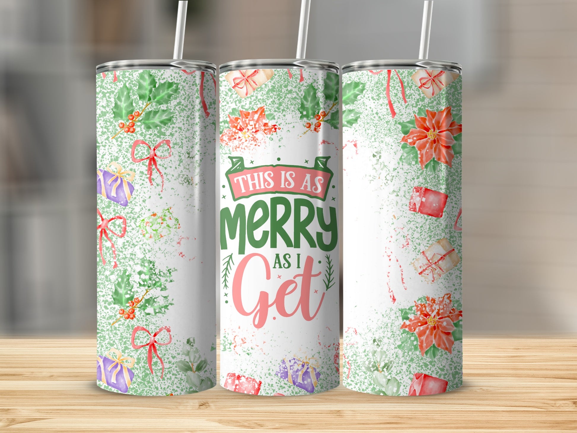 Three tumblers with a green, white, and red Christmas pattern.