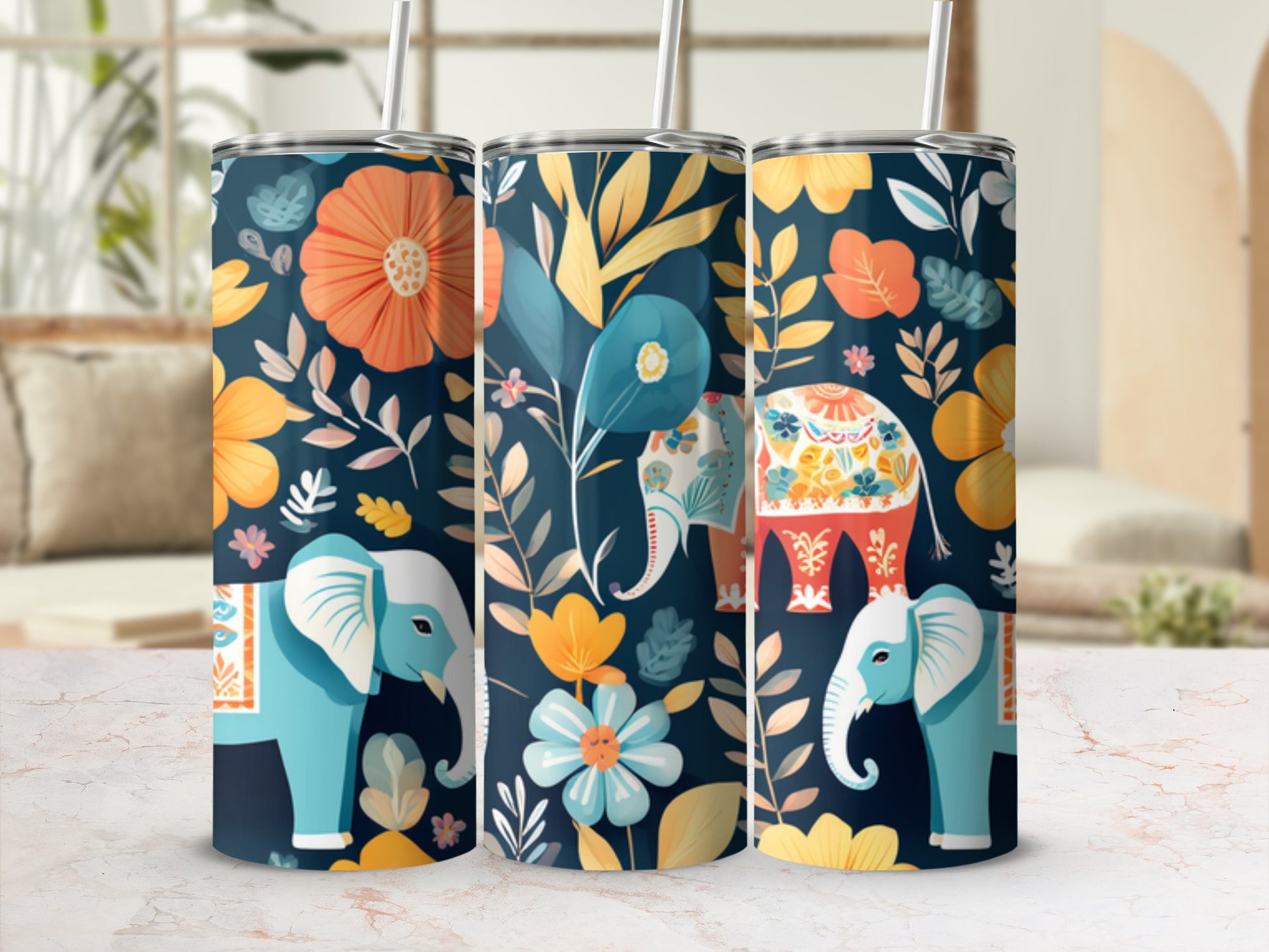 Three tumblers with elephants and floral patterns on a marbled surface.
