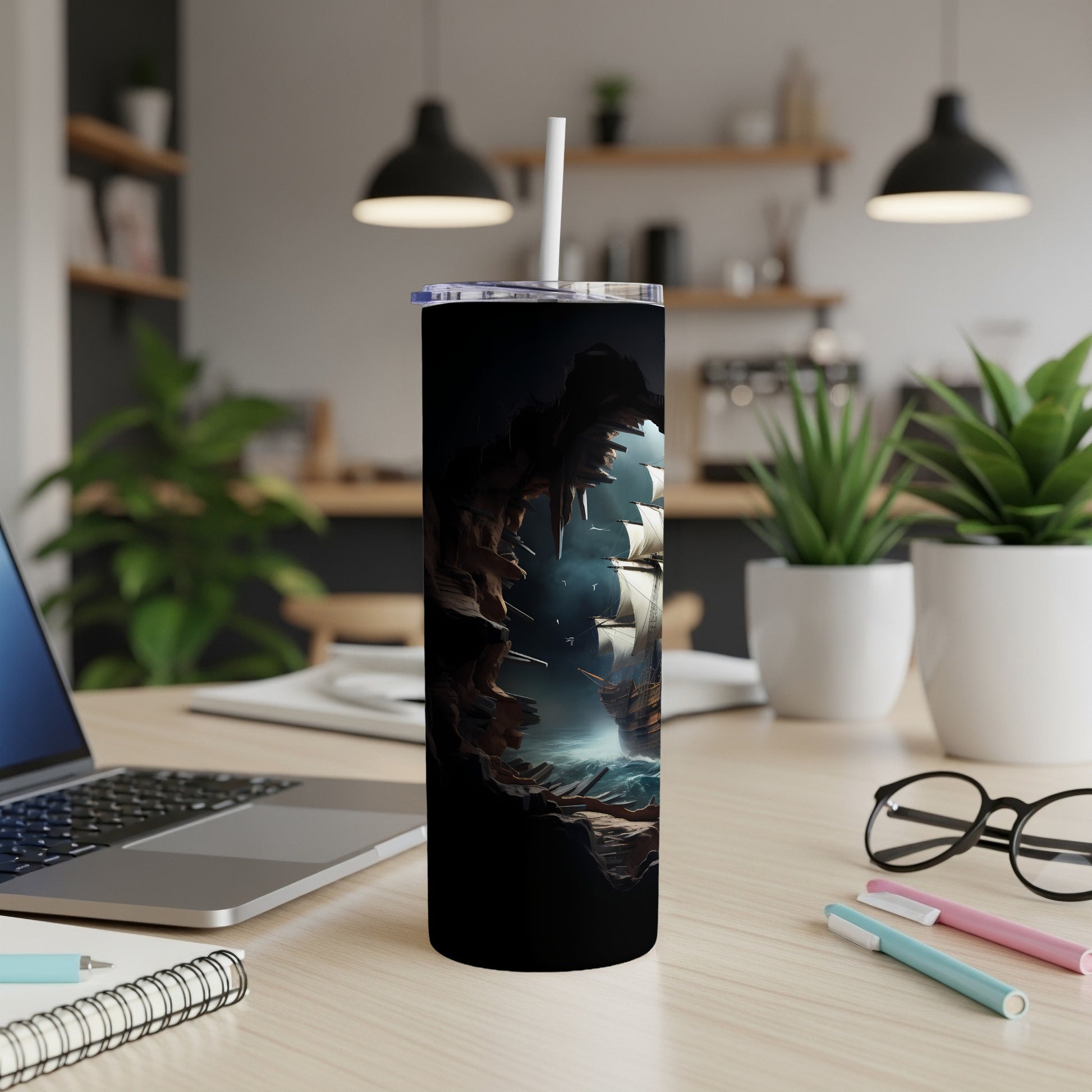 Sailboat emerging from a cave entrance depicted on a black tumbler.