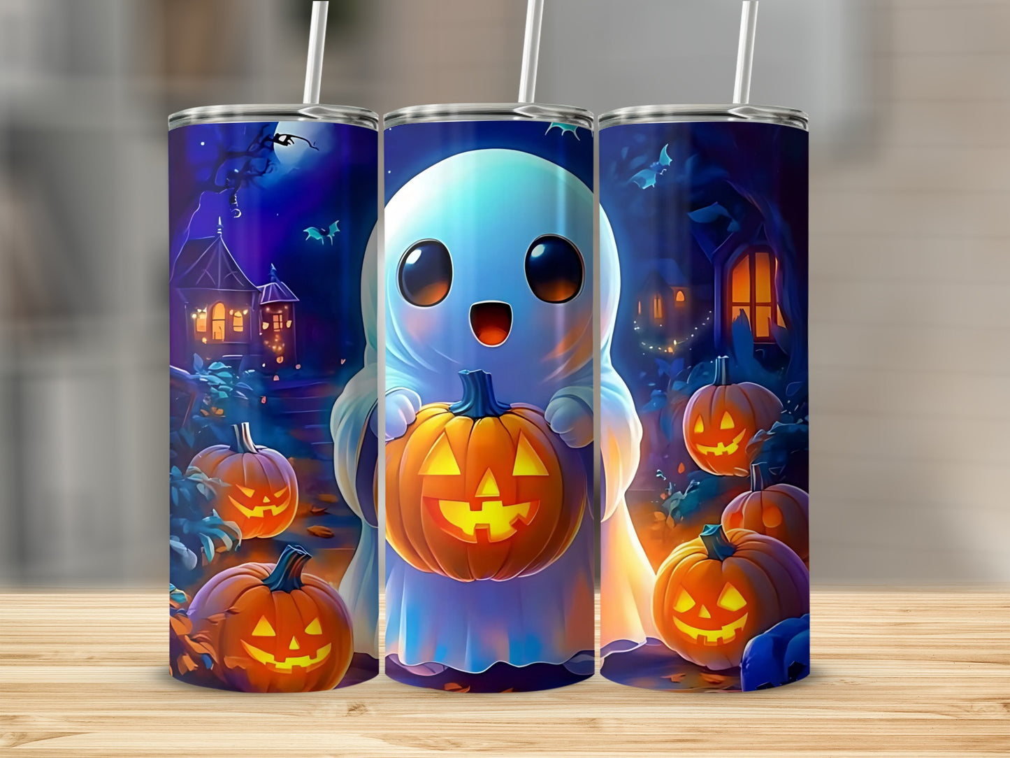 Three tumblers feature a cute ghost holding a jack-o'-lantern and Halloween decorations.
