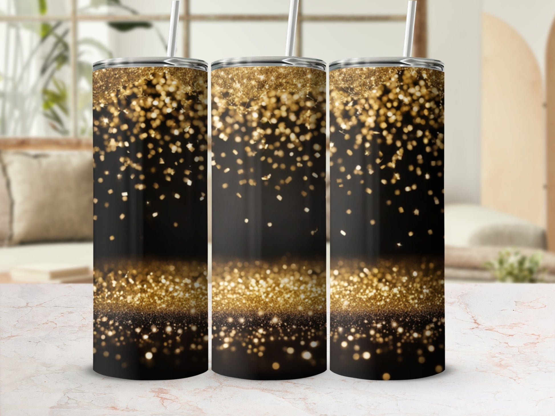 Three black tumblers with gold glitter falling from the top.