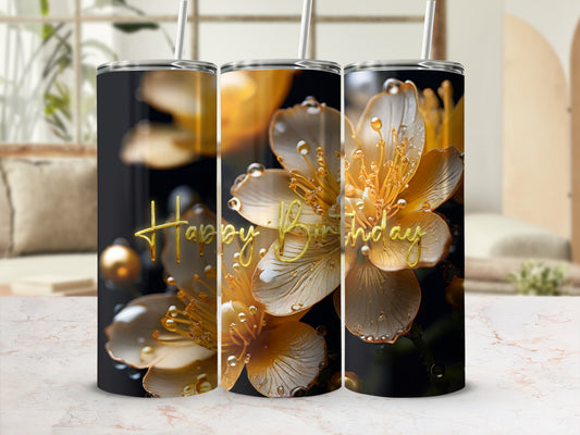 Tumbler with golden floral design and "Happy Birthday" text.