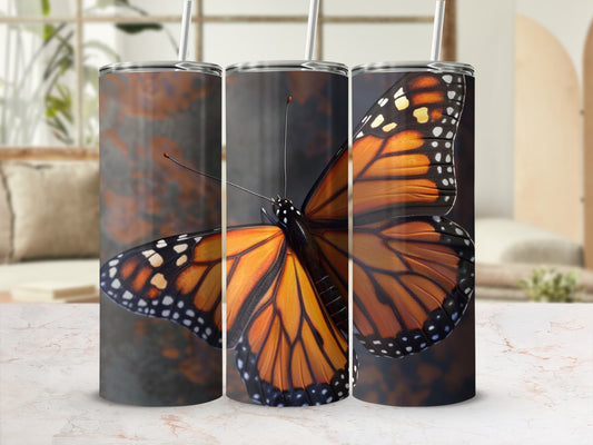 Triptych of monarch butterflies, front wing detail, on cylindrical tumblers.