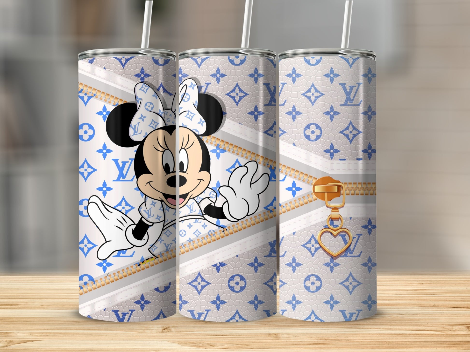 Minnie Mouse in designer print tumbler with gold zipper and heart charm.