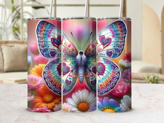 Butterfly and floral design on a cylindrical tumbler.
