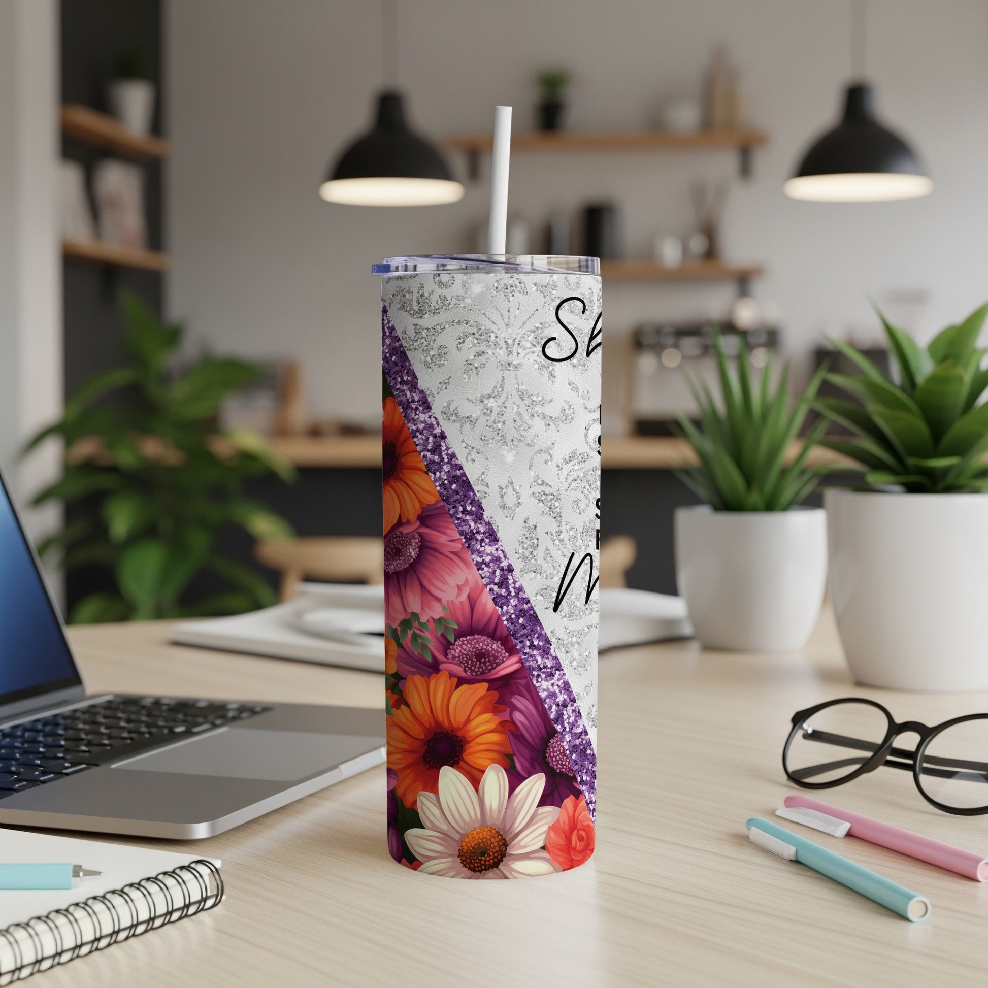 Floral tumbler with glitter accent and "She believed she could" text.