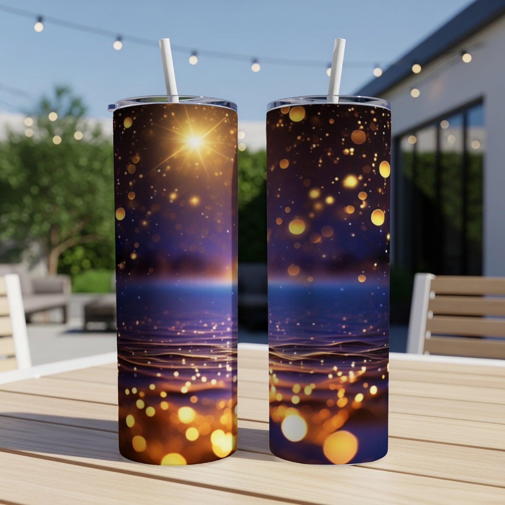 Two tall tumblers with a bokeh and starry night sky design.