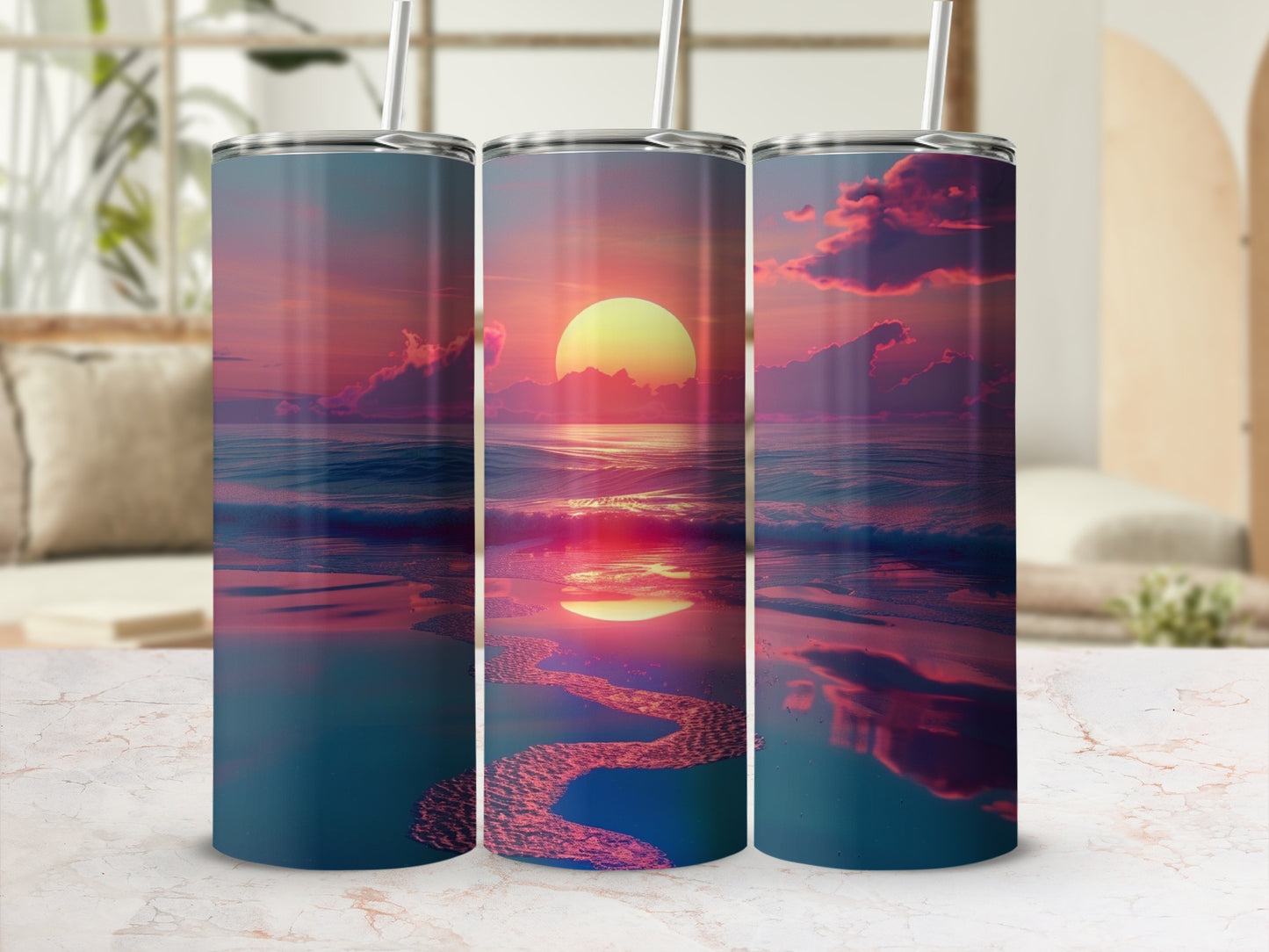 Three tumblers with a sunset beach reflection design.