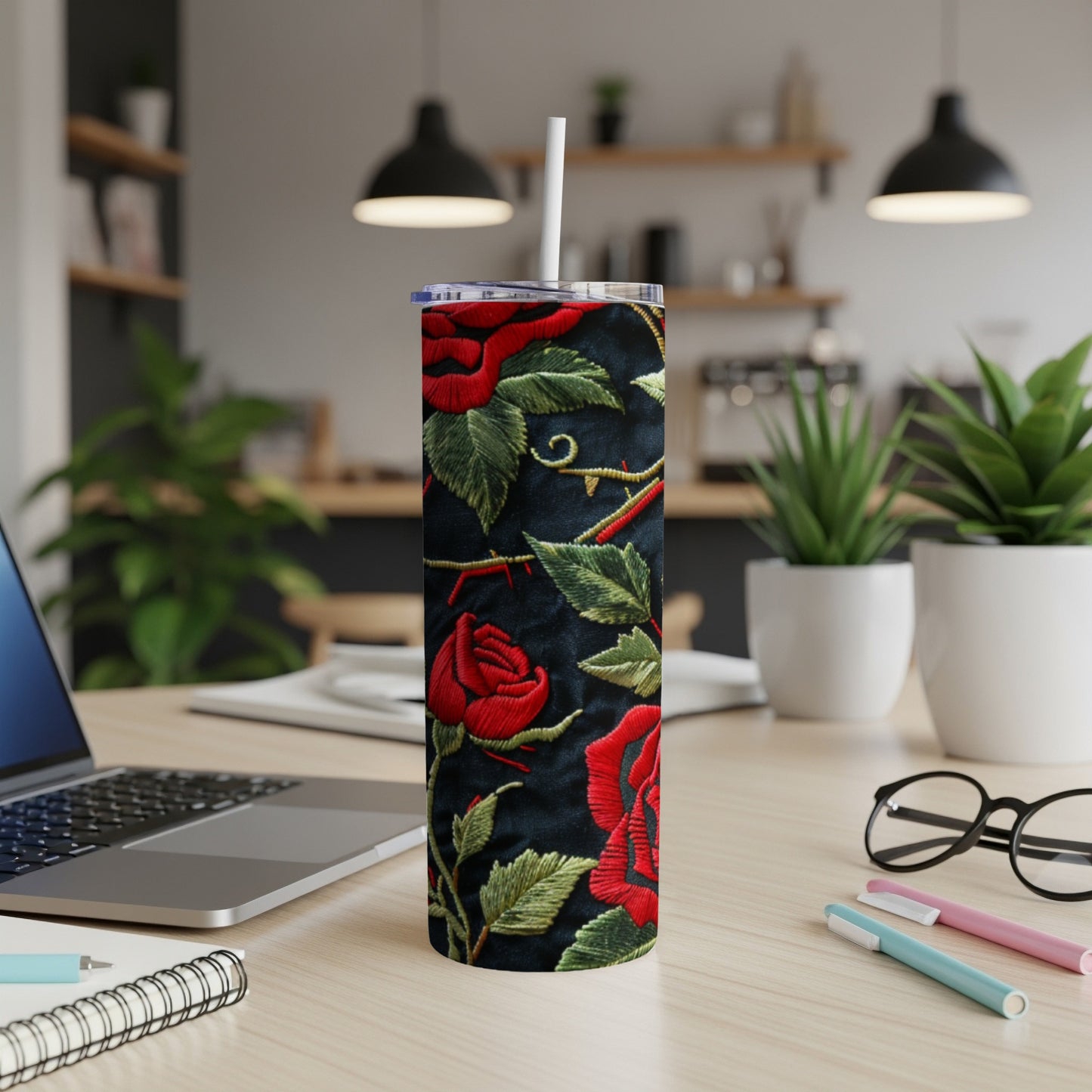 Tall black tumbler with red roses and green leaves design.